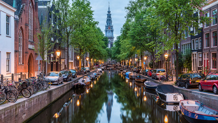 amsterdam city, illuminated building and canal at night, netherlands