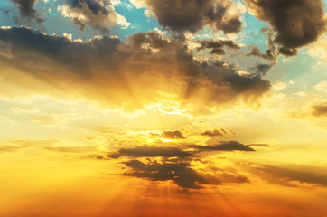 orange sunset in dramatic clouds