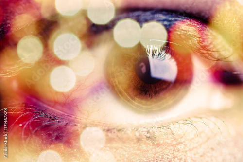 Fotografia Double exposure of an eye with bokeh
