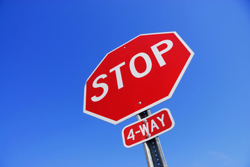 Wall Mural - stop sign against blue sky