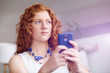 © Sergey Nivens - Happy beautiful young businesswoman using smart phone smiling
