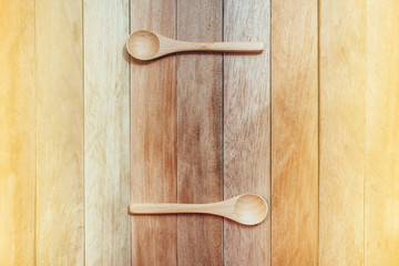 wooden spoon with wooden background