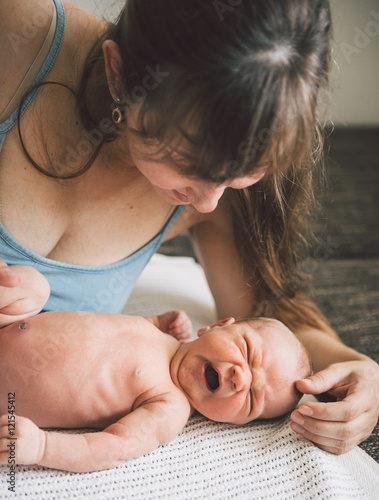 Fotomural Young mother and her newborn baby boy.