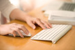 © sbw19 - Close up of woman hands using mouse and keyboard.