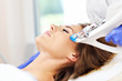 Woman having facial mesotherapy in beauty salon