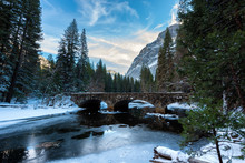 Snowy Winter Scene On A Road With Half Dome In The Background In Yosemite National Park