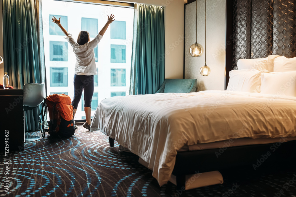Backpacker traveller happy to stay in five star hotel - obrazy, fototapety, plakaty 