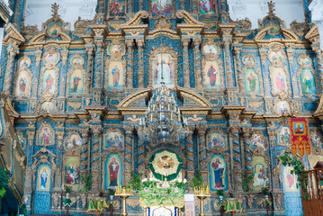 Wooden carved iconostasis in the Orthodox Church