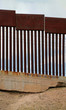 US-Mexican border as seen from Nogales, Mexico. The Spanish graffiti translates: 