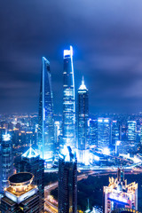 modern office buildings in shanghai at night