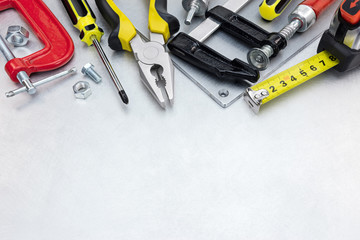 Canvas Print - set of different tools and instruments for house renovation and construction on scratched metal background