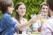 © PhotoAlto - Happy family toasting glasses