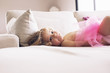 © PhotoAlto - Portrait of girl lying on bed at home