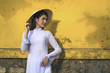Beautiful woman with Vietnam culture traditional dress, Ao dai is famous traditional costume , vintage style, Hoi an Vietnam