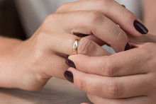 Divorce, Separation: Woman Removing Wedding Or Engagement Ring