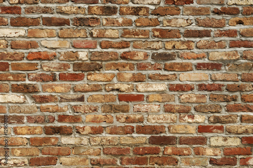 facade view of old brick wall background Canvas Print