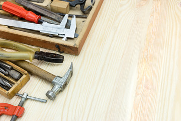 Sticker - wooden toolbox with old grungy instruments and tools for hand work