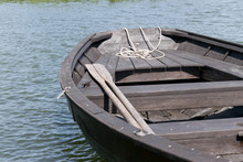 Wooden Oars In Rowing Boat On Lake.