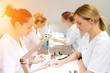 © Production Perig - Young attractive beautician students practising during courses