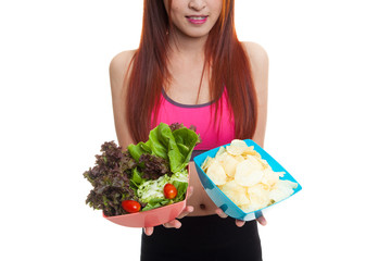 Wall Mural - Close up Asian healthy girl salad and potato chips.