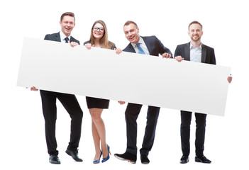 Your advertisement in good hands. Group of handsome young business people holding big blank with copy space. Isolated on white.