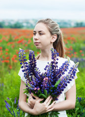 Poster - girl with bouquet of lupine flowers