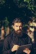 © Volodymyr - bearded man outdoor with pencil and note