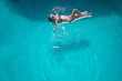 © Volodymyr - Young woman relaxing in pool