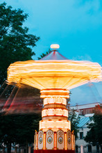 Blurred Motion Effect Of Illuminated Rotating Carousel Merry-Go-Round