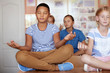 © Africa Studio - Schoolchildren in lotus position relaxing on lesson