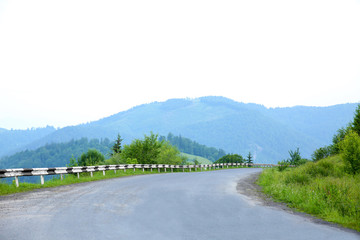 Canvas Print - Road in summer mountains