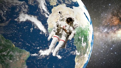 Wall Mural - astronaut in open space in front of earth
