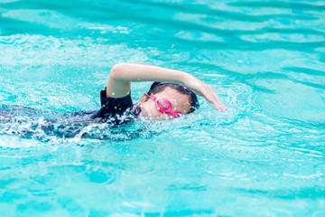 Wall Mural - Girl swimming in the pool