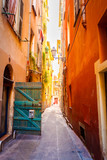 Fototapeta Uliczki - Narrow street in old part of Nice. Excellent French city with a touch of Provence.