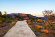 © fabio lamanna - Concrete footpath leading to Blyde River Canyon viewpoint, famous travel destination in South Africa. Scenic sunset light on the mountain ridges.