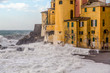 The Church and the wave in Camogli, Italy