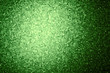 Green background with light spot of expanded polystyrene. Pattern from  slice of polystyrene on a gleam. Transparent, show through material
