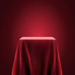 Presentation pedestal covered with a red silk cloth. Eps10 vector illustration.