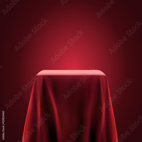 Fotografie, Obraz Presentation pedestal covered with a red silk cloth