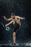 Fototapeta Sport - Water drops around football player under water