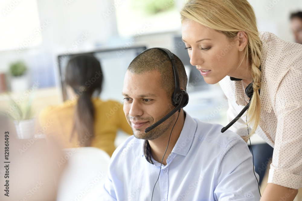 Teleoperator in office with manager Stock Photo | Adobe Stock