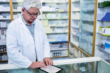 Wall Mural - Pharmacist using a digital tablet