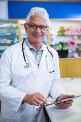 Wall Mural - Pharmacist using a digital tablet