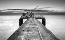 Ancient Industrial Pier, Black And White Pier With Hoist