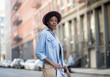 Portrait of fashionable African American woman standing on city