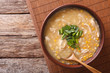 Chinese corn and chicken soup in a bowl close-up. horizontal top view
