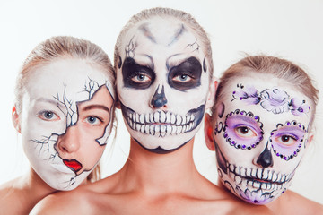 Wall Mural - Three girls with Halloween face art on white background