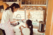 © torwaiphoto - Daughter helping her mother in the kitchen washing dishes, washi