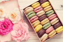 Colorful Macaroons In A Gift Box And Roses