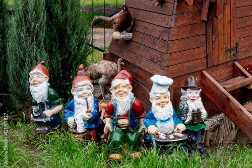 Fotografie, Obraz Dwarfs decorate the garden near the house